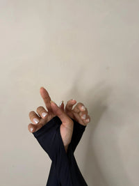 close up of thumbhole coverage on Black Long Sleeve Swimsuit | The Sulawesi Midnight - T