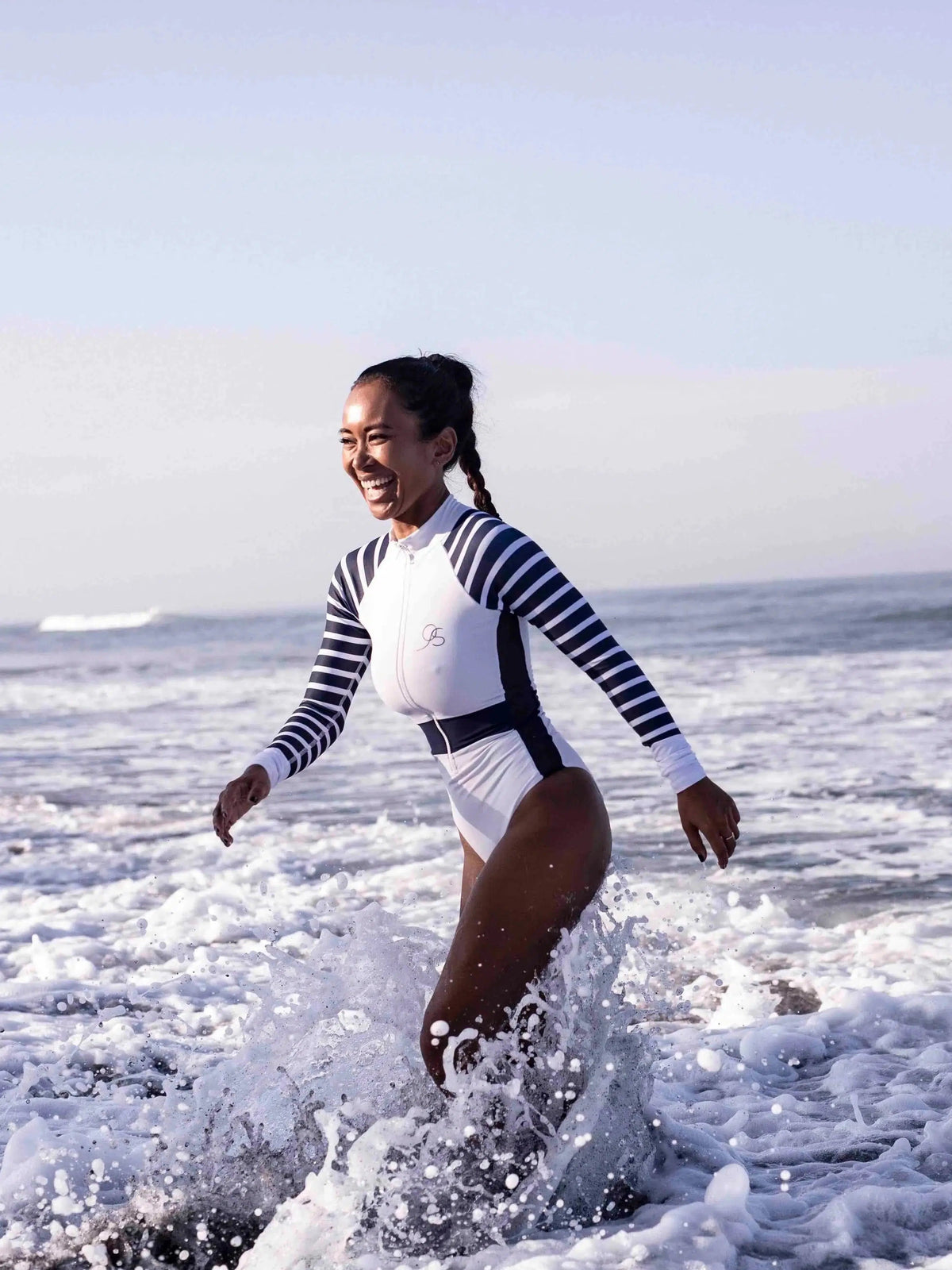 close up of white and navy Long Sleeve One Piece Swimsuit | The Sulawesi Snow and Navy-Ocean Soul Swimwear