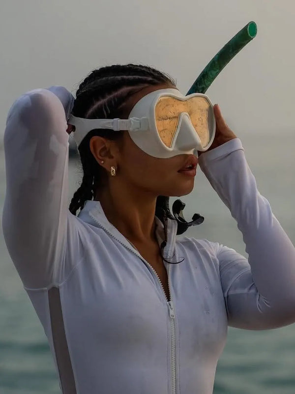 freediver wearing white Long Sleeve Swimsuit | The Sulawesi in Snow-Ocean Soul Swimwear