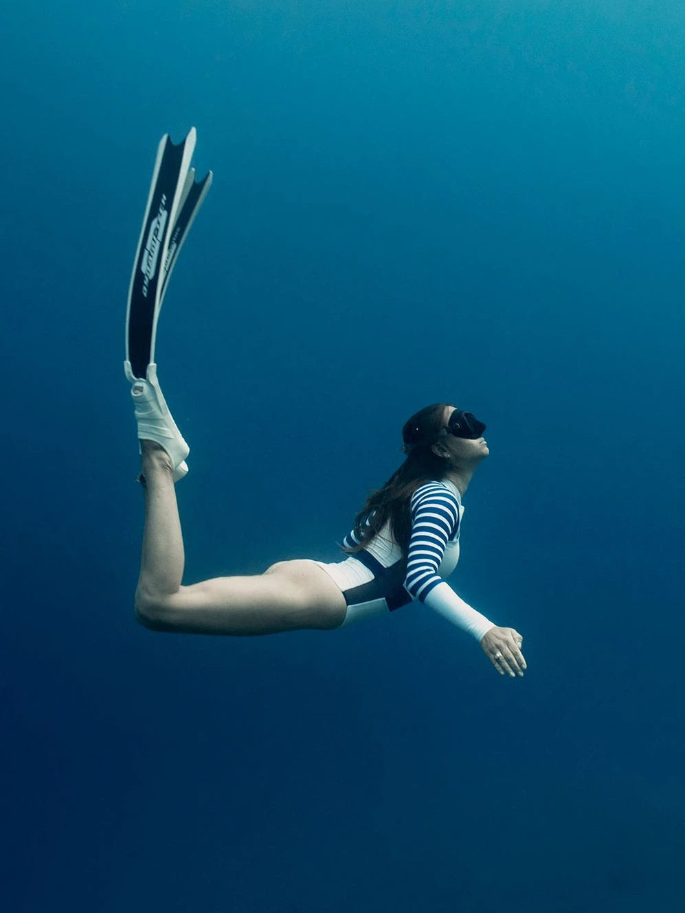 freediver wearing Long Sleeve One Piece Swimsuit | The Sulawesi Snow and Navy